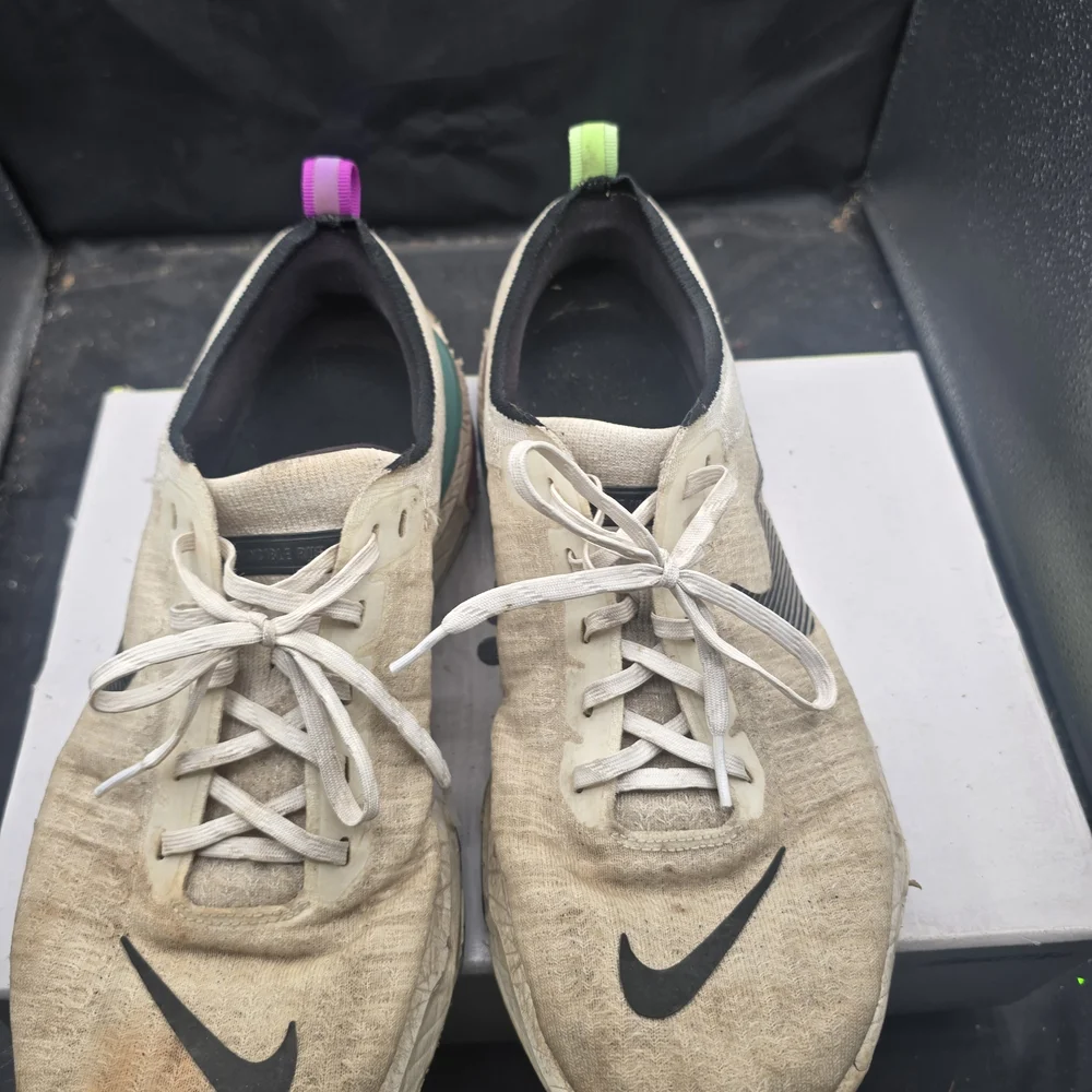 Nike Cream and Black Sneakers with Vibrant Heel‎ Accents